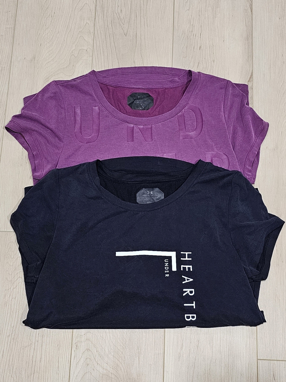 2 Women's Under Armour HeatGear Open-Back Activewear T-Shirts.